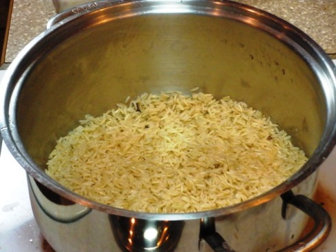 There's the parcooked rice, neatly layered into the bottom of the pan with a bit of each of the aroma waters.