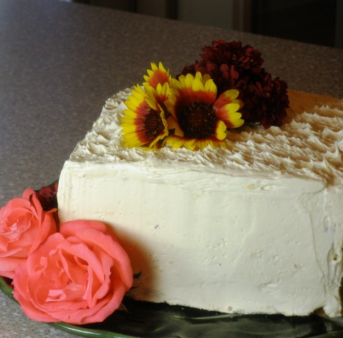 birthday cake decorated with fresh flowers